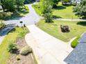 A home with a long driveway and a well-manicured front lawn at 35 Brooke Holw, Covington, GA 30016