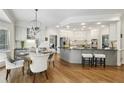 Open-concept kitchen with modern appliances, granite countertops, an island, and a breakfast nook at 905 Brooksglen Dr, Roswell, GA 30075