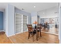 Dining area with mirrored wall and built-in bookcase next to the living room at 1421 Peachtree Ne St # 304, Atlanta, GA 30309