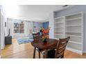 Inviting living room featuring a dining area, built-in bookcase, and a large window at 1421 Peachtree Ne St # 304, Atlanta, GA 30309