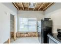 Kitchen area awaiting renovation; ample natural light streams through the window at 2255 Bigwood Trl, Atlanta, GA 30349