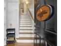 Inviting entryway with staircase, light hardwood floors, and Summerhill Estates sign at 576 Fraser Se St, Atlanta, GA 30312