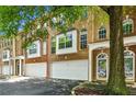 Charming brick townhome featuring a two-car garage, and a covered entryway at 576 Fraser Se St, Atlanta, GA 30312