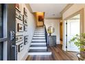 Welcoming foyer features hardwood floors, staircase, and curated photo gallery at 661 Auburn Ne Ave # 10, Atlanta, GA 30312