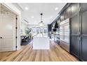 Gourmet kitchen featuring stainless steel appliances, custom cabinets, and a center island for dining at 661 Auburn Ne Ave # 10, Atlanta, GA 30312