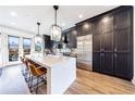 This modern kitchen features dark wood cabinets, stainless steel appliances, and a stunning island at 661 Auburn Ne Ave # 10, Atlanta, GA 30312