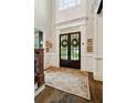 Elegant foyer features hardwood floors, wainscoting, and double front doors at 2870 Redding Ne Rd, Atlanta, GA 30319