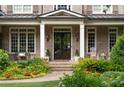 Close-up of a welcoming front porch with brickwork and classic details at 2870 Redding Ne Rd, Atlanta, GA 30319