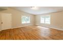 Spacious room with light-filled windows and hardwood floors at 4201 Hicks Rd, Austell, GA 30106