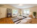 Bright living room with hardwood floors, neutral decor, and ample seating at 4201 Hicks Rd, Austell, GA 30106