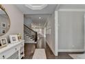 Inviting foyer boasts hardwood floors and a view of the staircase at 13055 Fox Rd, Alpharetta, GA 30005