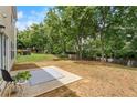 Expansive backyard with a patio and ample space for outdoor activities and gardening at 411 Sugar Maple Ct, Canton, GA 30114