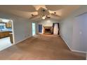 Spacious living room featuring a brick fireplace, vaulted ceiling, and neutral color palette at 608 Fairhaven Blvd, Stockbridge, GA 30281