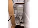 Small bathroom featuring a pedestal sink, toilet, and built-in shelving at 1643 Westhaven Sw Dr, Atlanta, GA 30311