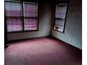 Bedroom with red carpet and two windows offering natural light at 1643 Westhaven Sw Dr, Atlanta, GA 30311