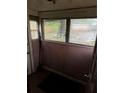 Enclosed porch with multiple windows and wood paneling at 1643 Westhaven Sw Dr, Atlanta, GA 30311