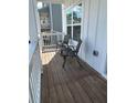 Cozy front porch featuring two chairs and a small table at 409 Ruths Blvd, Woodstock, GA 30188