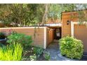 Attractive home boasting a cozy entrance with a fenced front yard featuring lush greenery and a one-car garage at 845 Lake Hollow Sw Blvd, Marietta, GA 30064