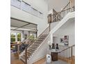 Elegant two-story foyer featuring beautiful staircase and decor at 4815 Ramblewood Dr, Cumming, GA 30028
