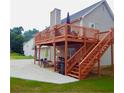 Expansive backyard deck and patio provides ample space for outdoor entertaining and relaxation at 95 Revere Dr, Fairburn, GA 30213