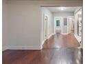 View of hallway with wood floors and laundry machines in the background, enhancing functionality at 1100 Welch Sw St, Atlanta, GA 30310