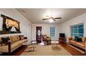 Cozy living room featuring hardwood floors, an artistic display, and lots of natural light at 1100 Welch Sw St, Atlanta, GA 30310