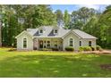 Attractive single-story home with manicured landscaping and a spacious front yard, offering a welcoming ambiance at 836 Palmetto Tyrone Rd, Sharpsburg, GA 30277
