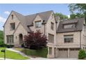 Attractive brick home with a two-car garage and manicured landscaping at 1849 Rock Springs Ne Ln, Atlanta, GA 30324