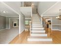 Elegant foyer features hardwood floors, a staircase with iron spindles, and neutral paint at 2154 Marne Nw Gln, Kennesaw, GA 30152