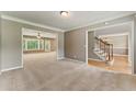Spacious living room features plush carpeting, and ample natural light at 2154 Marne Nw Gln, Kennesaw, GA 30152
