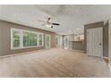 Bright living room boasts lots of natural light and a ceiling fan at 2154 Marne Nw Gln, Kennesaw, GA 30152