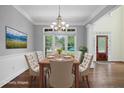 Dining room with hardwood floors, ample natural light, and space for Gathering gatherings at 2455 Ivey Oaks Rd, Cumming, GA 30041