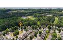 Community aerial view showing the home's location within a tree-lined neighborhood at 556 Poplar Bnd, Canton, GA 30114