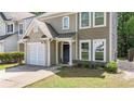 Charming two-story home with a one-car garage and inviting front entrance at 556 Poplar Bnd, Canton, GA 30114