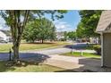 Peaceful street view showcases the quiet neighborhood and well-maintained homes at 556 Poplar Bnd, Canton, GA 30114