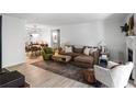 Bright living room with a comfortable couch, area rug, and adjacent dining area at 1303 Wingate Way, Atlanta, GA 30350