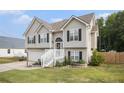 Charming two-story home with neutral siding, black shutters, an inviting front entrance and well-maintained lawn at 251 Hunt Club Cir, Temple, GA 30179