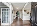 Inviting foyer with hardwood floors and views into the living spaces at 321 Woodbrook Crst, Canton, GA 30114