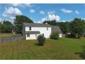 Spacious backyard featuring a well-maintained lawn and privacy fence at 1012 Gloria Grand Blvd, Mcdonough, GA 30252