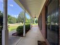 Long front porch with brick facade and pillars at 1012 Gloria Grand Blvd, Mcdonough, GA 30252