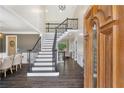 Spacious foyer featuring a staircase with iron railings and hardwood floors at 5041 Corinault Nw Pl, Acworth, GA 30101