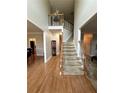 Grand foyer with hardwood floors and a staircase leading to the second floor overlook at 1270 Heritage Lakes Dr, Mableton, GA 30126