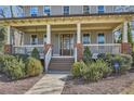 Charming home featuring a welcoming front porch with brick accents and manicured landscaping at 2987 Jefferson St, Atlanta, GA 30341
