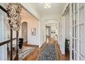Inviting hallway with hardwood floors, arched doorways, and natural light at 2987 Jefferson St, Atlanta, GA 30341