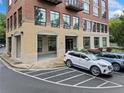 A ground level view of a brick building entrance with parking at 319 Atlanta Se St # 315, Marietta, GA 30060