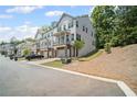 Two-story townhome features a private, covered porch and a two-car garage at 507 Bishop Ln, Woodstock, GA 30188