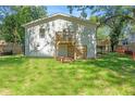 Expansive backyard featuring a wooden deck and walkout basement entrance at 1363 Diamond Se Ave, Atlanta, GA 30316