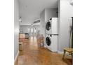 Laundry room with modern stacked washer and dryer, offering convenience and space-saving design at 5300 Peachtree Rd # 105, Atlanta, GA 30341