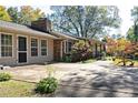 Exterior view of home with long driveway and covered front porch, beautiful yard at 255 Shipp Cir, Hiram, GA 30141