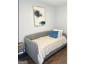 Inviting bedroom with a daybed, stylish decor, and dark hardwood flooring at 1081 Ashby Grv, Atlanta, GA 30314
